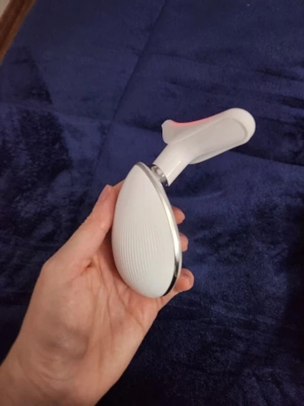 Customer photo holding the facial beauty device